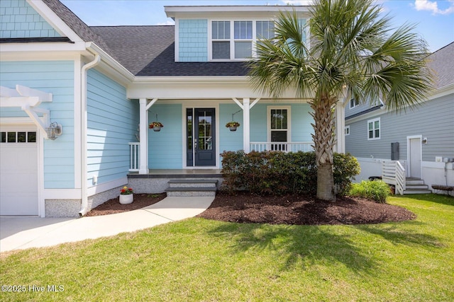 view of front facade featuring an attached garage, a porch, a shingled roof, and a front lawn