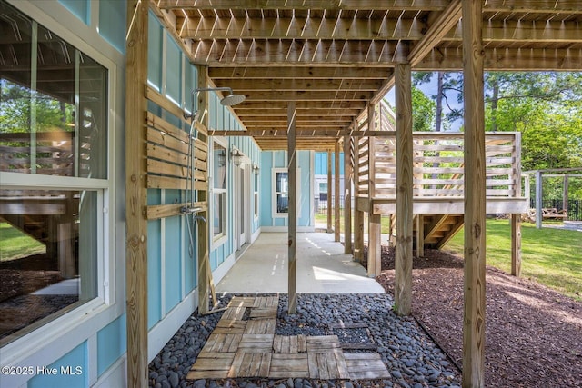 view of patio / terrace with stairway and a deck