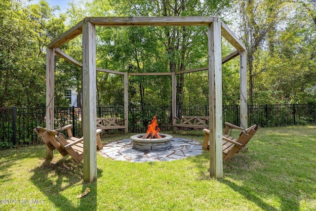 exterior space with fence and an outdoor fire pit