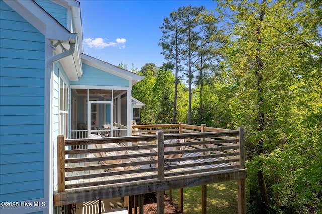 wooden deck with a sunroom