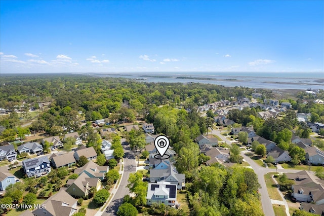 aerial view with a water view, a residential view, and a wooded view