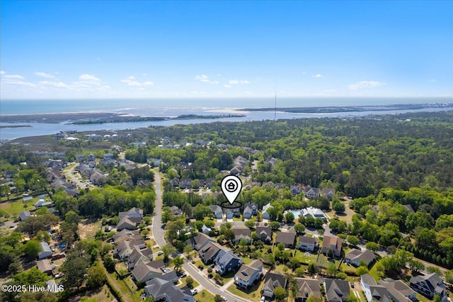 bird's eye view with a view of trees, a residential view, and a water view