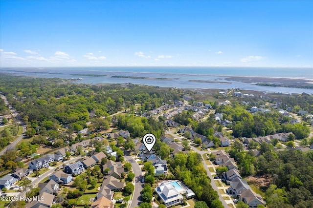 birds eye view of property with a water view and a residential view