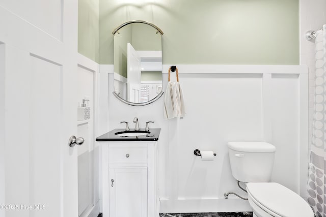 bathroom with toilet and vanity