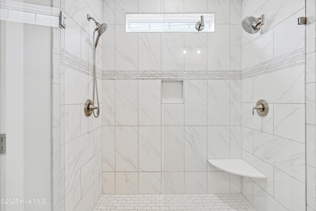 bathroom featuring a shower stall