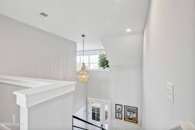 stairway featuring a notable chandelier, recessed lighting, and visible vents