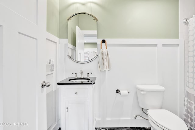bathroom featuring vanity and toilet