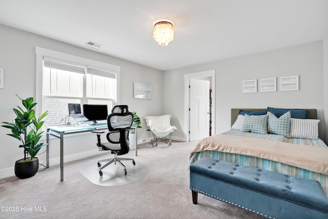 bedroom featuring visible vents, baseboards, and carpet
