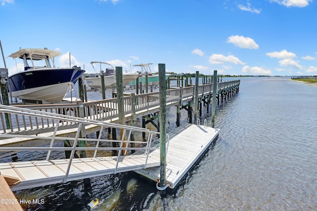 view of dock featuring boat lift and a water view