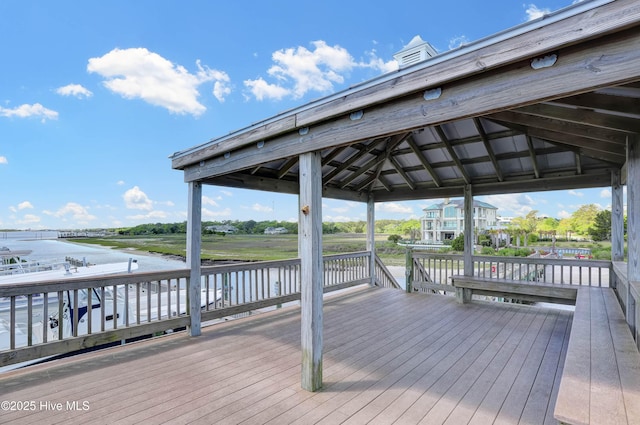 deck with a gazebo and a water view