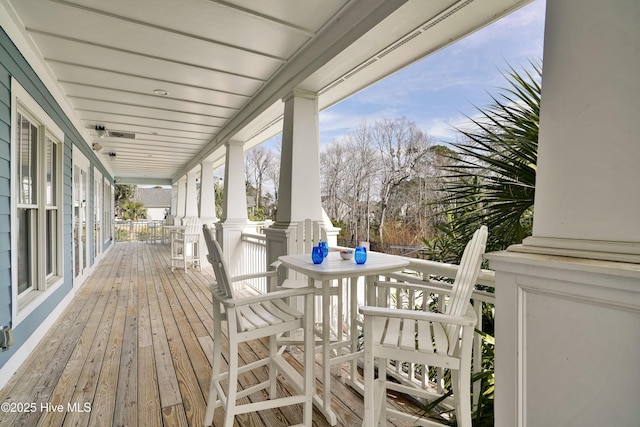 wooden terrace with a porch