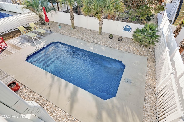 view of swimming pool with a patio area