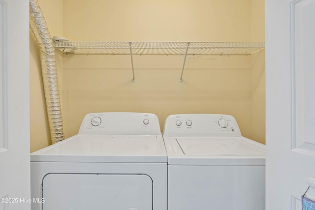 laundry area with washing machine and dryer