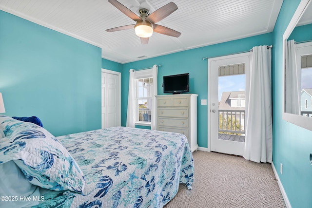 bedroom with ceiling fan, light colored carpet, access to exterior, and a closet