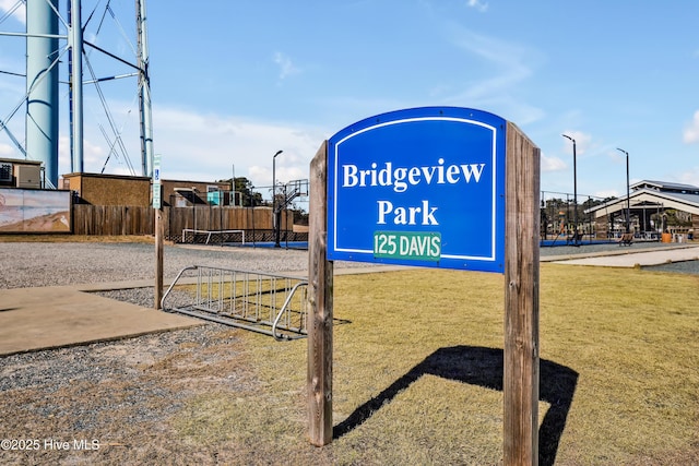 community / neighborhood sign with a lawn