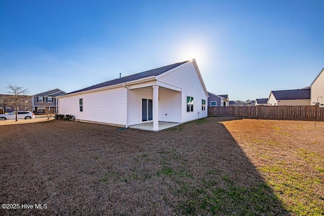 back of house with a patio