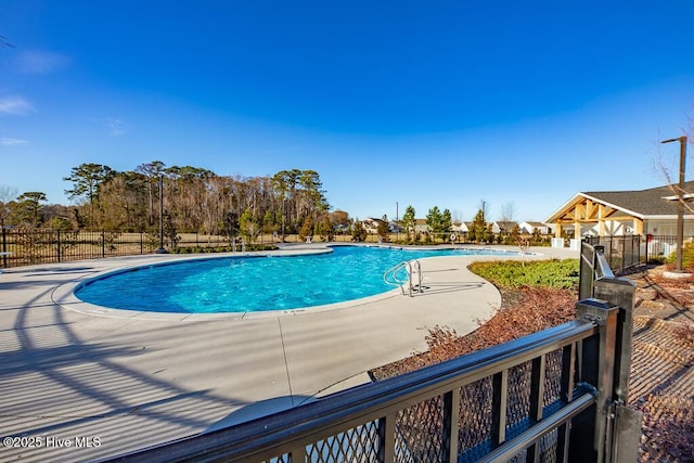 view of pool featuring a patio