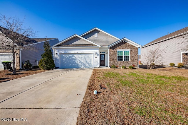 view of front of house featuring a garage, a front yard, concrete driveway, and stone siding