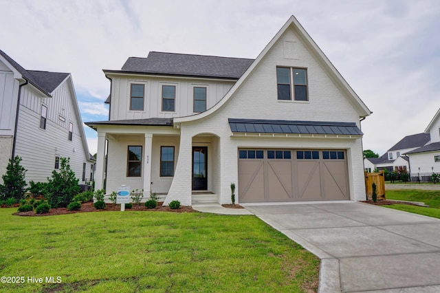 modern farmhouse style home with a garage, covered porch, and a front yard