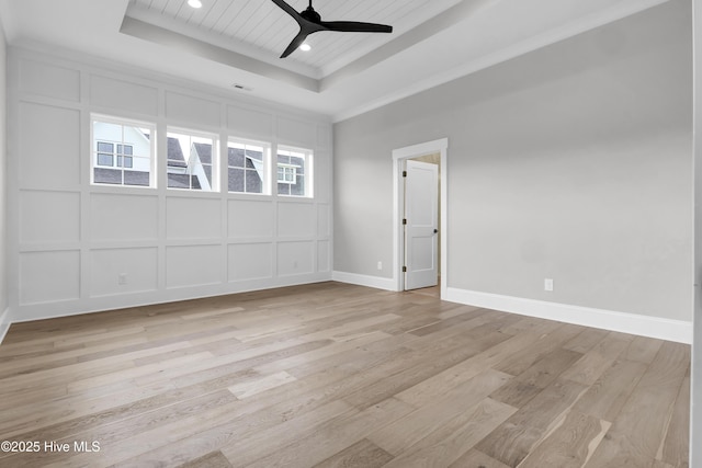 unfurnished room with ceiling fan, wooden ceiling, a raised ceiling, and light wood-type flooring