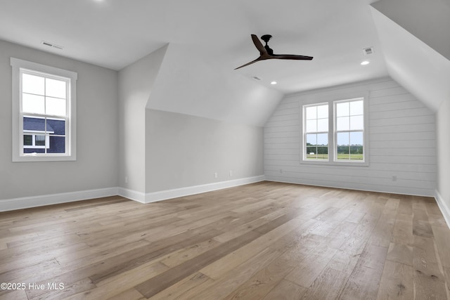 bonus room with lofted ceiling, ceiling fan, and light hardwood / wood-style flooring