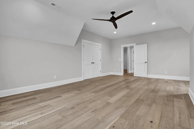 bonus room with ceiling fan and light hardwood / wood-style floors