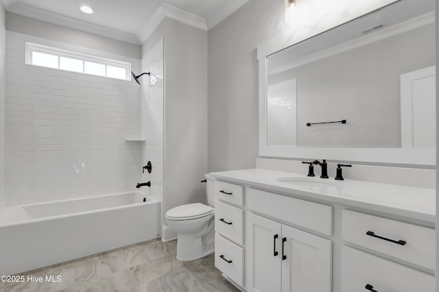 full bathroom featuring vanity, crown molding, toilet, and tiled shower / bath