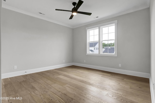 spare room with crown molding, ceiling fan, and light wood-type flooring