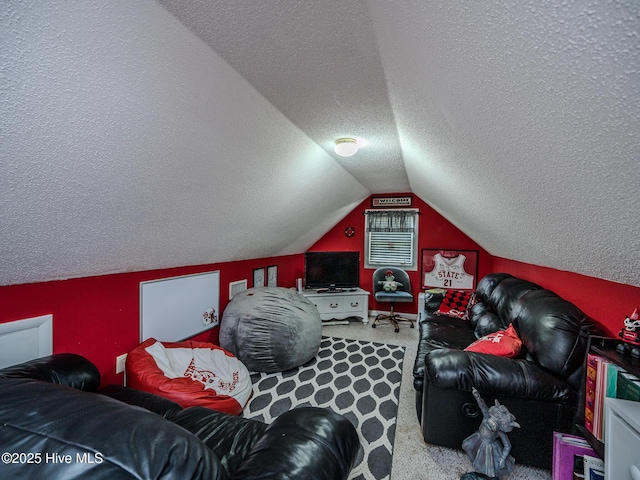 interior space with carpet flooring, vaulted ceiling, and a textured ceiling