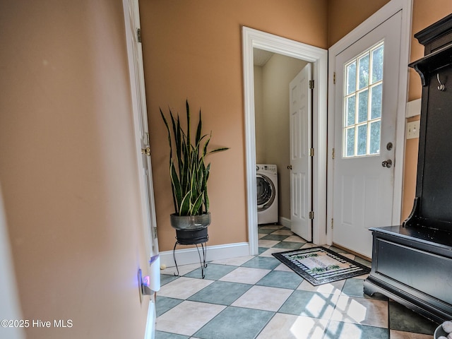 doorway to outside with washer / clothes dryer