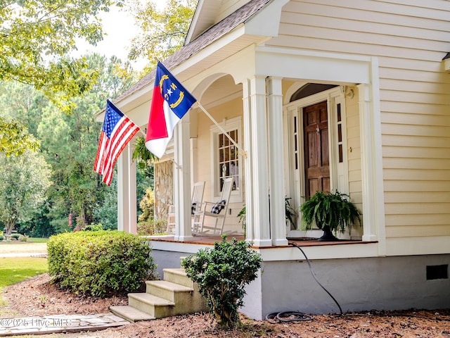 doorway to property featuring covered porch