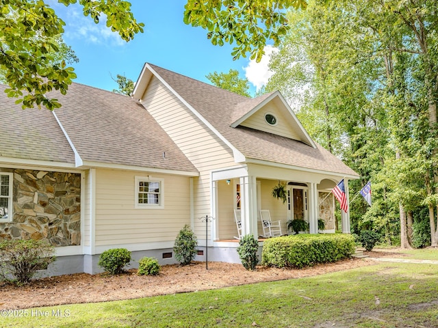 view of front of house with a porch and a front lawn