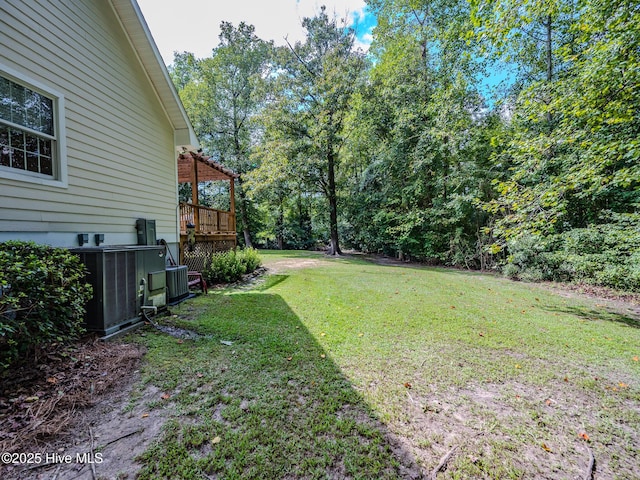 view of yard featuring a wooden deck, cooling unit, and a pergola