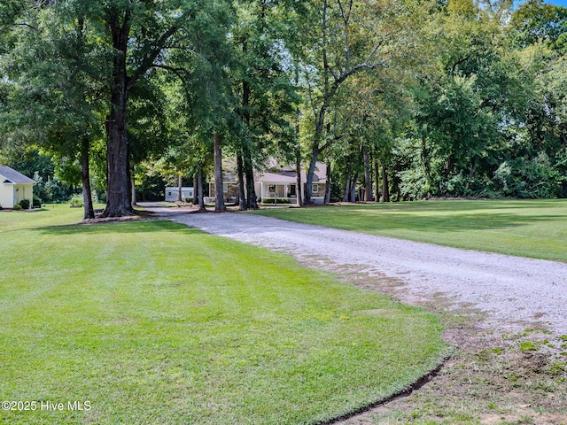 view of property's community with a lawn