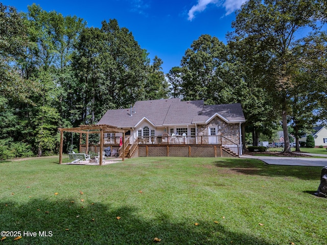 back of house featuring a wooden deck, a lawn, a patio area, and a pergola