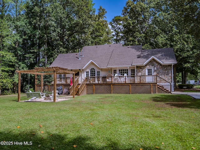 back of property with a yard, a pergola, a patio, and a deck