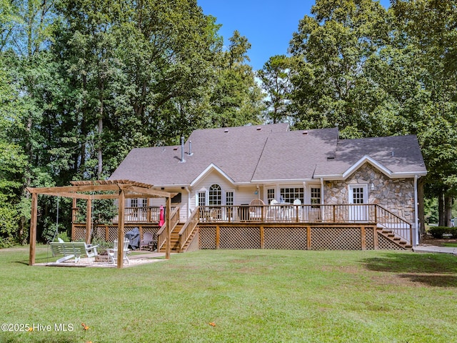 rear view of house featuring a patio, a lawn, a deck, and a pergola