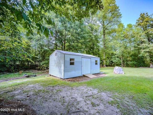 view of outdoor structure with a yard