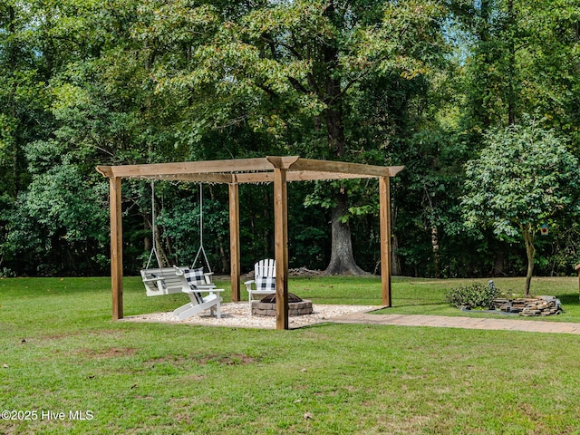 view of yard with a fire pit