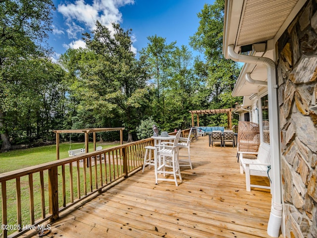 deck with an outdoor hangout area, a yard, and a pergola