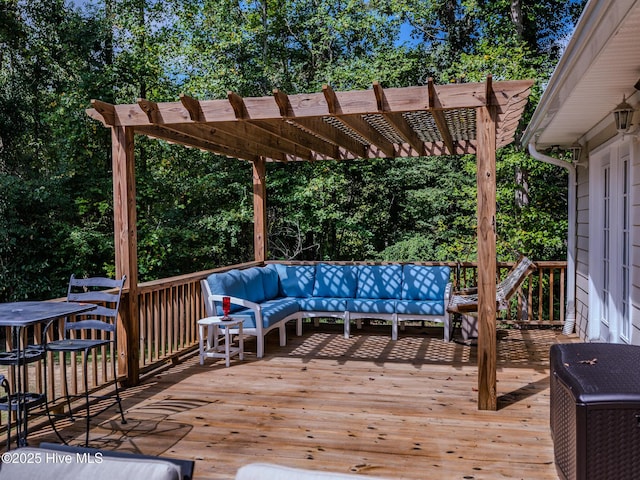 wooden terrace with a pergola and an outdoor hangout area