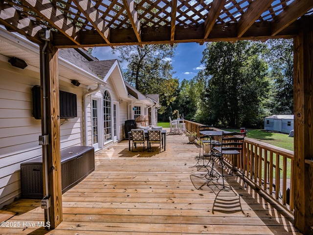 wooden terrace with a pergola