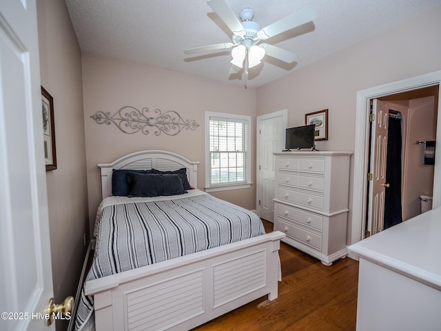 bedroom featuring dark wood-type flooring and ceiling fan