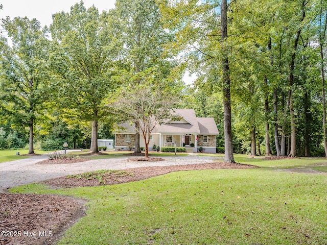 view of front of property featuring covered porch and a front yard