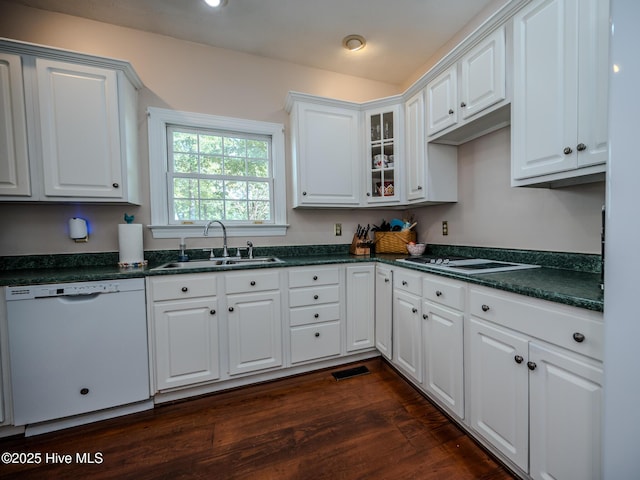 kitchen featuring white cabinetry, sink, dark wood-type flooring, and white appliances