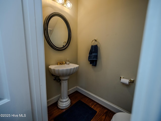 bathroom with hardwood / wood-style flooring