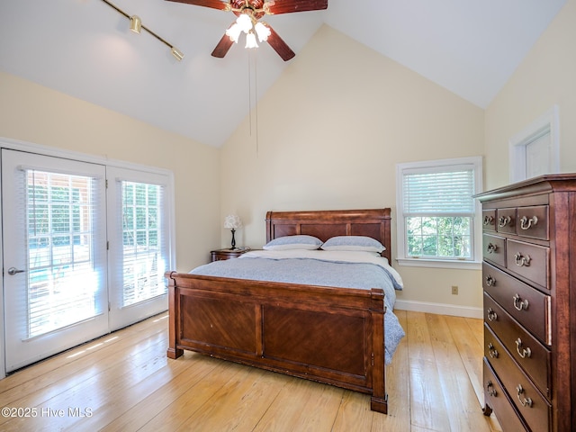 bedroom with ceiling fan, high vaulted ceiling, access to exterior, and light wood-type flooring