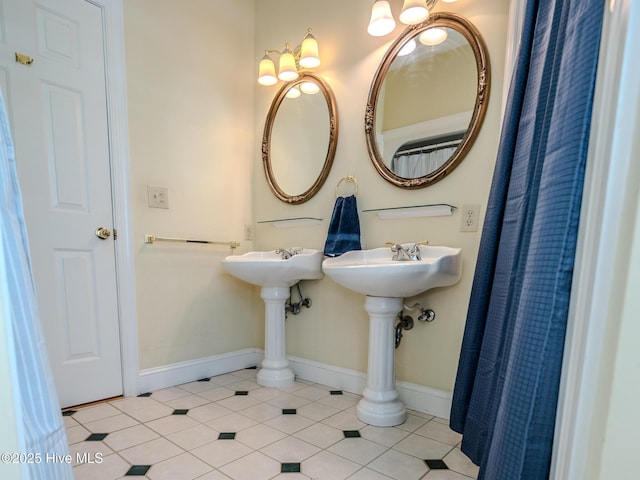 bathroom featuring tile patterned flooring and sink