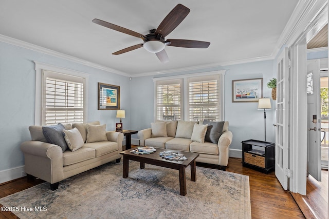 living room with crown molding, dark wood-type flooring, and ceiling fan