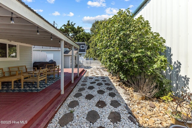 wooden deck with grilling area